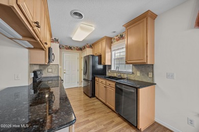 Enjoy easy living in this 2-bedroom, 2-bath patio home located on Cypress Landing Golf Club in North Carolina - for sale on GolfHomes.com, golf home, golf lot