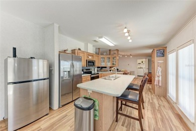 Welcome to this 3-bedroom, 2-bath fully furnished turnkey mobile on Kings Gate Golf Club in Florida - for sale on GolfHomes.com, golf home, golf lot