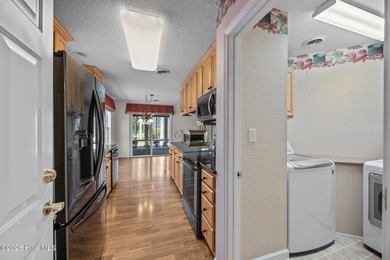 Enjoy easy living in this 2-bedroom, 2-bath patio home located on Cypress Landing Golf Club in North Carolina - for sale on GolfHomes.com, golf home, golf lot