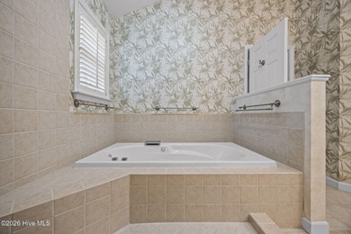 Enjoy easy living in this 2-bedroom, 2-bath patio home located on Cypress Landing Golf Club in North Carolina - for sale on GolfHomes.com, golf home, golf lot