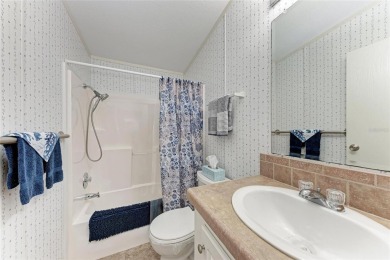 Welcome to this 3-bedroom, 2-bath fully furnished turnkey mobile on Kings Gate Golf Club in Florida - for sale on GolfHomes.com, golf home, golf lot