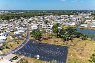 Welcome to this 3-bedroom, 2-bath fully furnished turnkey mobile on Kings Gate Golf Club in Florida - for sale on GolfHomes.com, golf home, golf lot
