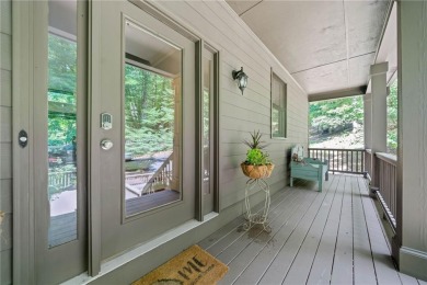 Nestled in a serene natural setting, this breathtaking 3-story on Big Canoe Golf Club - Cherokee in Georgia - for sale on GolfHomes.com, golf home, golf lot