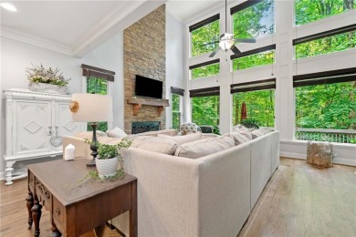 Nestled in a serene natural setting, this breathtaking 3-story on Big Canoe Golf Club - Cherokee in Georgia - for sale on GolfHomes.com, golf home, golf lot