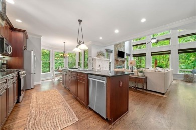 Nestled in a serene natural setting, this breathtaking 3-story on Big Canoe Golf Club - Cherokee in Georgia - for sale on GolfHomes.com, golf home, golf lot