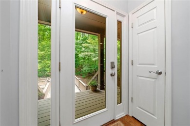 Nestled in a serene natural setting, this breathtaking 3-story on Big Canoe Golf Club - Cherokee in Georgia - for sale on GolfHomes.com, golf home, golf lot