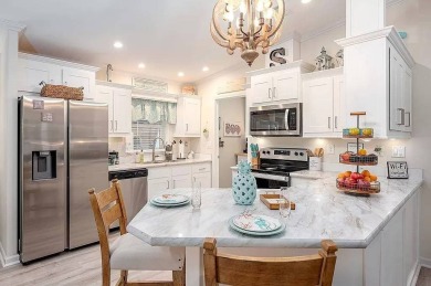 Welcome to Your Slice of Paradise in Old Bridge Village!  Step on Riverbend Golf and Country Club in Florida - for sale on GolfHomes.com, golf home, golf lot