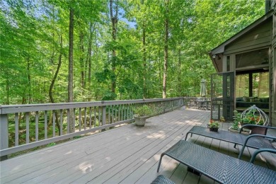 Nestled in a serene natural setting, this breathtaking 3-story on Big Canoe Golf Club - Cherokee in Georgia - for sale on GolfHomes.com, golf home, golf lot