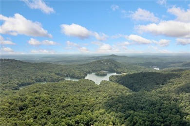 Nestled in a serene natural setting, this breathtaking 3-story on Big Canoe Golf Club - Cherokee in Georgia - for sale on GolfHomes.com, golf home, golf lot