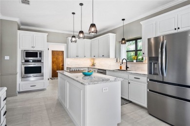 Elegant all-brick that overlooks a pond, Rockport golf course on Rockport Country Club in Texas - for sale on GolfHomes.com, golf home, golf lot