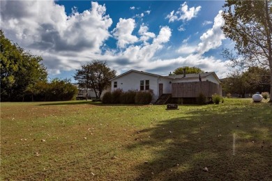 Come fall in love with this beautifully maintained five-lot on Linn Valley Lakes - Deer Trace Golf Course in Kansas - for sale on GolfHomes.com, golf home, golf lot