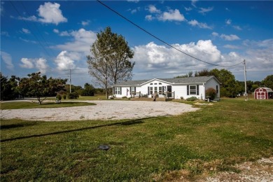 Come fall in love with this beautifully maintained five-lot on Linn Valley Lakes - Deer Trace Golf Course in Kansas - for sale on GolfHomes.com, golf home, golf lot