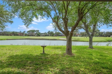 Elegant all-brick that overlooks a pond, Rockport golf course on Rockport Country Club in Texas - for sale on GolfHomes.com, golf home, golf lot