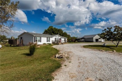 Come fall in love with this beautifully maintained five-lot on Linn Valley Lakes - Deer Trace Golf Course in Kansas - for sale on GolfHomes.com, golf home, golf lot