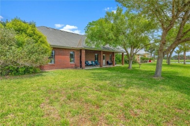 Elegant all-brick that overlooks a pond, Rockport golf course on Rockport Country Club in Texas - for sale on GolfHomes.com, golf home, golf lot