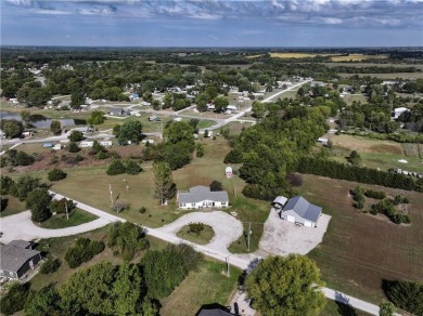 Come fall in love with this beautifully maintained five-lot on Linn Valley Lakes - Deer Trace Golf Course in Kansas - for sale on GolfHomes.com, golf home, golf lot