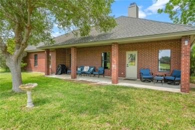 Elegant all-brick that overlooks a pond, Rockport golf course on Rockport Country Club in Texas - for sale on GolfHomes.com, golf home, golf lot