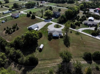 Come fall in love with this beautifully maintained five-lot on Linn Valley Lakes - Deer Trace Golf Course in Kansas - for sale on GolfHomes.com, golf home, golf lot