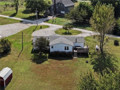 Come fall in love with this beautifully maintained five-lot on Linn Valley Lakes - Deer Trace Golf Course in Kansas - for sale on GolfHomes.com, golf home, golf lot