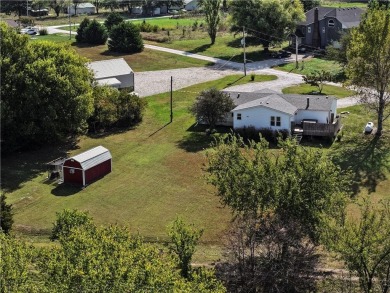 Come fall in love with this beautifully maintained five-lot on Linn Valley Lakes - Deer Trace Golf Course in Kansas - for sale on GolfHomes.com, golf home, golf lot