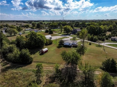 Come fall in love with this beautifully maintained five-lot on Linn Valley Lakes - Deer Trace Golf Course in Kansas - for sale on GolfHomes.com, golf home, golf lot