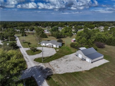 Come fall in love with this beautifully maintained five-lot on Linn Valley Lakes - Deer Trace Golf Course in Kansas - for sale on GolfHomes.com, golf home, golf lot