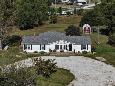 Come fall in love with this beautifully maintained five-lot on Linn Valley Lakes - Deer Trace Golf Course in Kansas - for sale on GolfHomes.com, golf home, golf lot