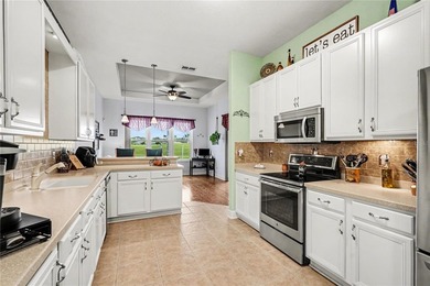 Experience EXCEPTIONAL Florida living in this Gorgeous golf on Tampa Bay Golf and Country Club in Florida - for sale on GolfHomes.com, golf home, golf lot