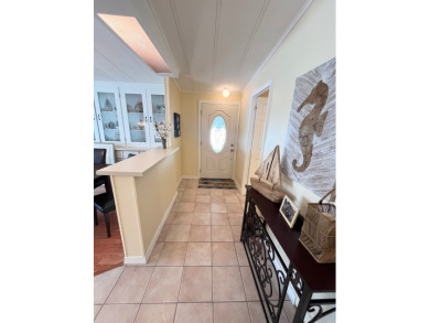 From the moment you walk through the door, you'll fall in love on Pine Lakes Country Club in Florida - for sale on GolfHomes.com, golf home, golf lot