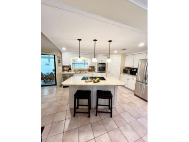 From the moment you walk through the door, you'll fall in love on Pine Lakes Country Club in Florida - for sale on GolfHomes.com, golf home, golf lot