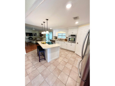 From the moment you walk through the door, you'll fall in love on Pine Lakes Country Club in Florida - for sale on GolfHomes.com, golf home, golf lot