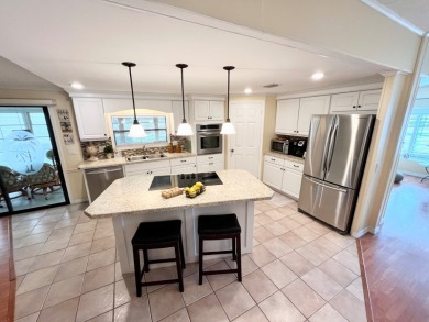 From the moment you walk through the door, you'll fall in love on Pine Lakes Country Club in Florida - for sale on GolfHomes.com, golf home, golf lot