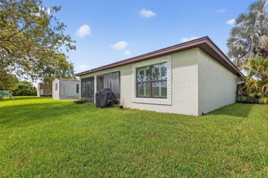 Enjoy gorgeous lake views from this gently lived-in home in a on Spanish Lakes Fairways in Florida - for sale on GolfHomes.com, golf home, golf lot