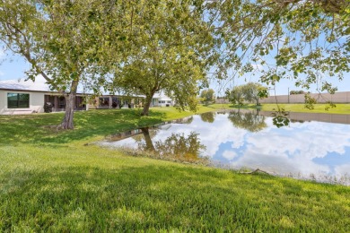 Enjoy gorgeous lake views from this gently lived-in home in a on Spanish Lakes Fairways in Florida - for sale on GolfHomes.com, golf home, golf lot