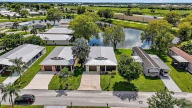 Enjoy gorgeous lake views from this gently lived-in home in a on Spanish Lakes Fairways in Florida - for sale on GolfHomes.com, golf home, golf lot