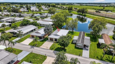 Enjoy gorgeous lake views from this gently lived-in home in a on Spanish Lakes Fairways in Florida - for sale on GolfHomes.com, golf home, golf lot