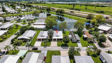Enjoy gorgeous lake views from this gently lived-in home in a on Spanish Lakes Fairways in Florida - for sale on GolfHomes.com, golf home, golf lot