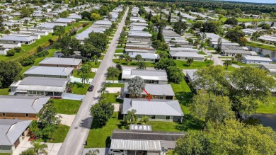 Enjoy gorgeous lake views from this gently lived-in home in a on Spanish Lakes Fairways in Florida - for sale on GolfHomes.com, golf home, golf lot
