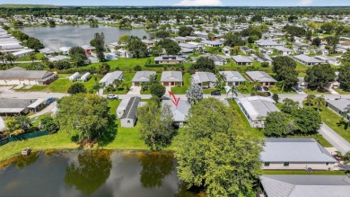 Enjoy gorgeous lake views from this gently lived-in home in a on Spanish Lakes Fairways in Florida - for sale on GolfHomes.com, golf home, golf lot