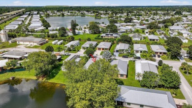 Enjoy gorgeous lake views from this gently lived-in home in a on Spanish Lakes Fairways in Florida - for sale on GolfHomes.com, golf home, golf lot