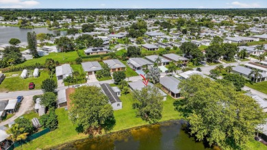 Enjoy gorgeous lake views from this gently lived-in home in a on Spanish Lakes Fairways in Florida - for sale on GolfHomes.com, golf home, golf lot