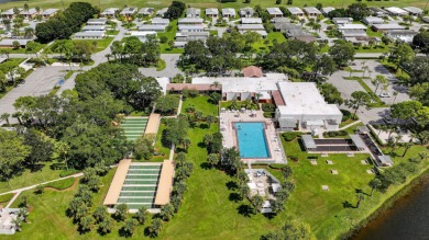 Enjoy gorgeous lake views from this gently lived-in home in a on Spanish Lakes Fairways in Florida - for sale on GolfHomes.com, golf home, golf lot