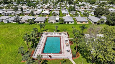 Enjoy gorgeous lake views from this gently lived-in home in a on Spanish Lakes Fairways in Florida - for sale on GolfHomes.com, golf home, golf lot