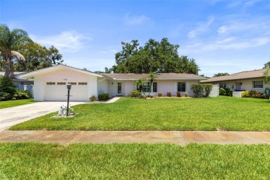 Welcome to your dream home in one of Dunedin's most desirable on The Dunedin Country Club in Florida - for sale on GolfHomes.com, golf home, golf lot