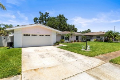 Welcome to your dream home in one of Dunedin's most desirable on The Dunedin Country Club in Florida - for sale on GolfHomes.com, golf home, golf lot