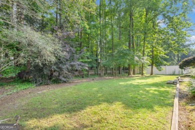 Tucked within the heart of Peachtree City's beloved Kenton Place on Braelinn Golf Club in Georgia - for sale on GolfHomes.com, golf home, golf lot