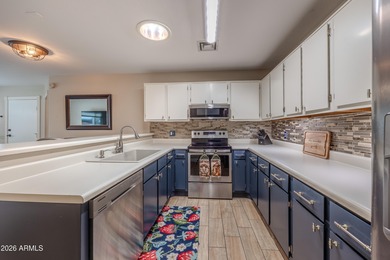 Beautifully appointed and meticulously maintained, this on Sun Village Golf Course in Arizona - for sale on GolfHomes.com, golf home, golf lot