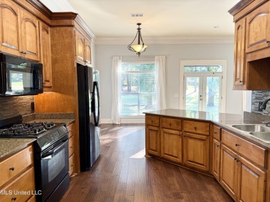 This inviting home sits on the Whisper Lake Golf Course in the on Annandale Golf Club in Mississippi - for sale on GolfHomes.com, golf home, golf lot