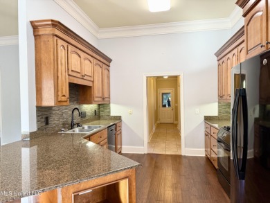 This inviting home sits on the Whisper Lake Golf Course in the on Annandale Golf Club in Mississippi - for sale on GolfHomes.com, golf home, golf lot