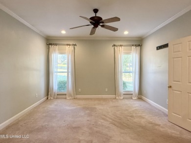 This inviting home sits on the Whisper Lake Golf Course in the on Annandale Golf Club in Mississippi - for sale on GolfHomes.com, golf home, golf lot